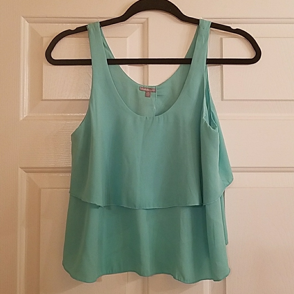 Polyester tank with open back